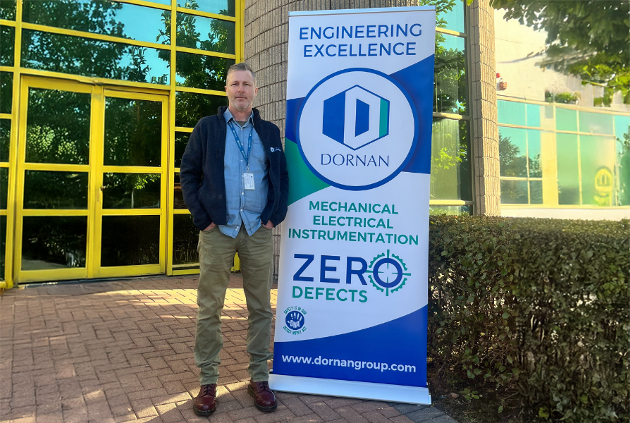 Man standing in front of the Dornan Mechanical Electrical Instrumentation headquarters